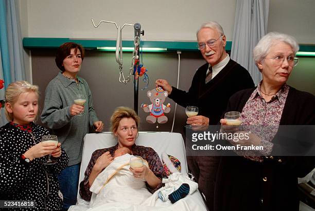 family visits mother with newborn - visit stock pictures, royalty-free photos & images