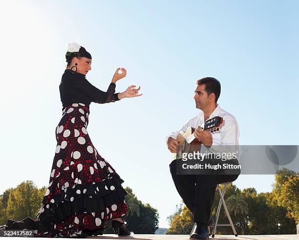 flamenco dancer and guitarist - flamencos stock-fotos und bilder