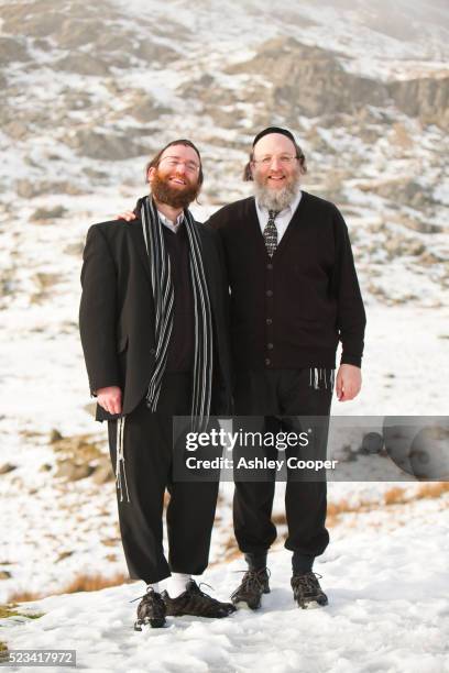 two orthodox jewish men pose for a photograph - jewish people stock-fotos und bilder