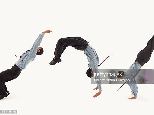 businessman doing backflips - backflipping stock pictures, royalty-free photos & images
