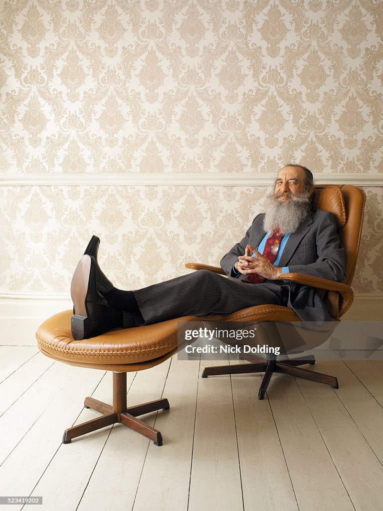 Man with Beard Sitting in Armchair