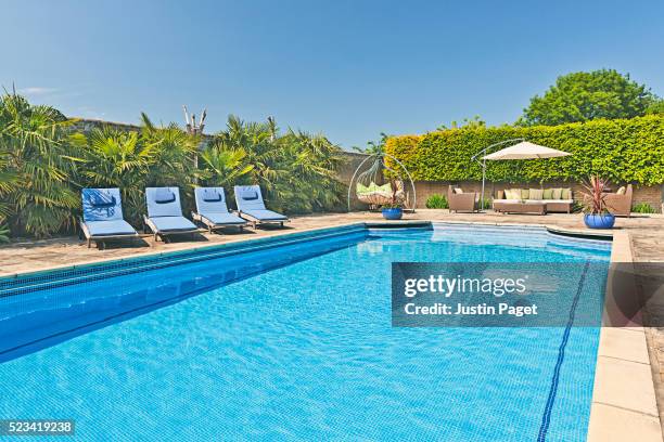 outdoor swimming pool - swimming pool stock pictures, royalty-free photos & images