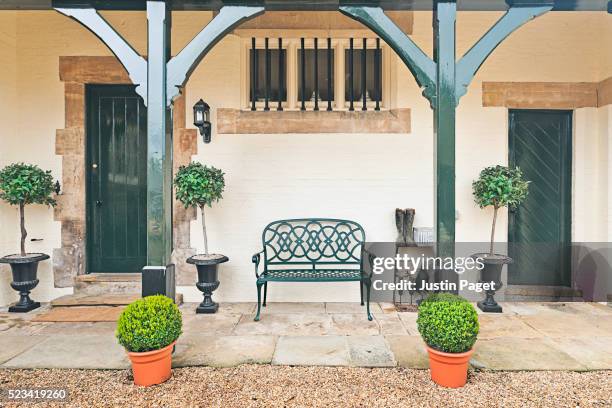 back door of english country house - back door stock pictures, royalty-free photos & images