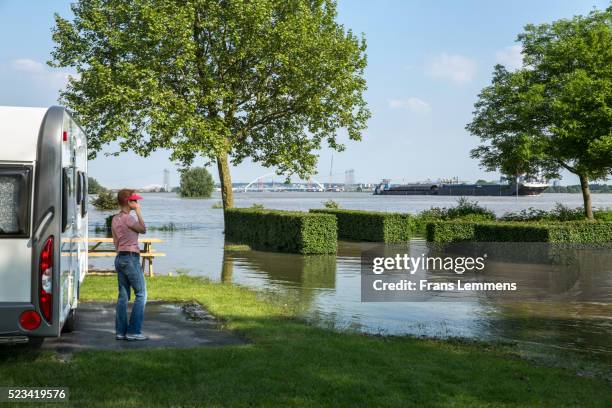 netherlands, slijk ewijk, high water threatens caravan - high tide stock pictures, royalty-free photos & images