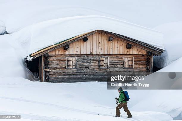 skitouring next to a barn - barn stock pictures, royalty-free photos & images