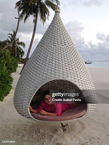 woman relaxed in hut on beach - laguna beach maldives stock pictures, royalty-free photos & images