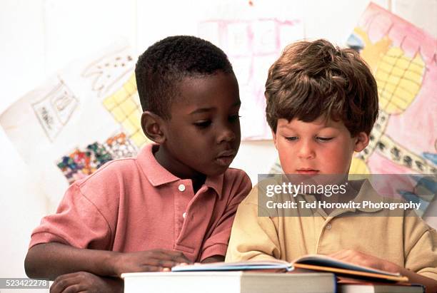 Sharing Books 3,022 Children Sharing Books Stock Photos, High-Res Pictures, and ...