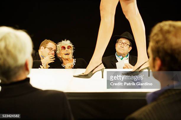 critics reacting during fashion show - fashion show stock pictures, royalty-free photos & images