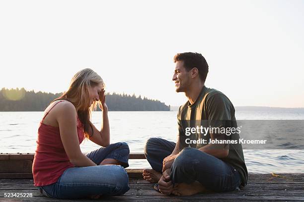 man and woman talking - embarrassed girlfriend stock pictures, royalty-free photos & images