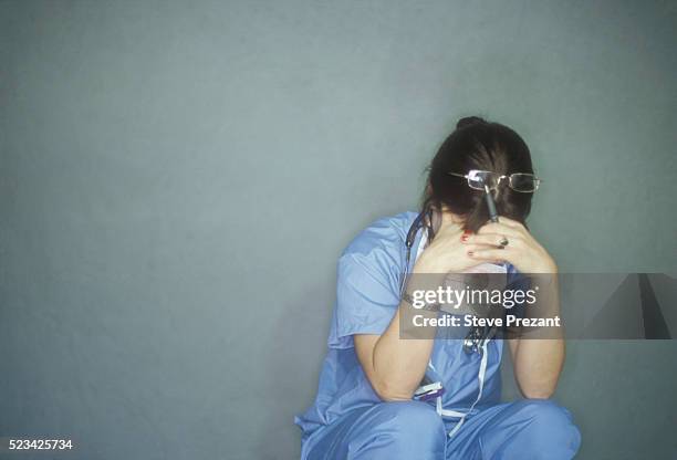 upset surgeon - sad nurse stock pictures, royalty-free photos & images