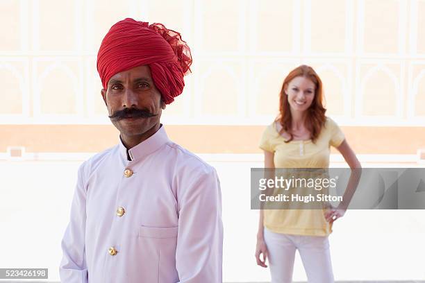 palace guard with tourist standing behind him - hugh sitton india stock pictures, royalty-free photos & images