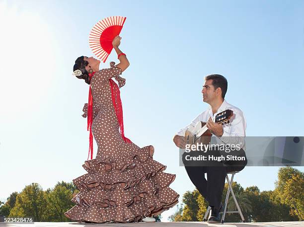 flamenco dancer and guitarist - flamencos stock-fotos und bilder