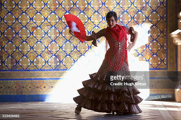 flamenco dancer with fan - flamencos stock-fotos und bilder