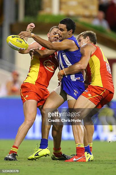 Lindsay Thomas of the Kangaroos kicks during the round five AFL match between the Gold Coast Suns and the North Melbourne Kangaroos at Metricon...