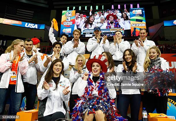 Ashley Wagner of Team North America celebrates with team captain Kristi Yamaguchi and teammates after seeing her score following the Ladies Singles...