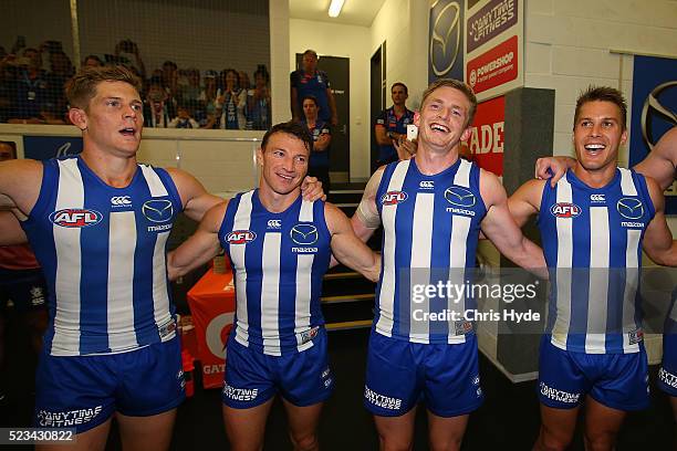 Kangaroos sing the team song after winning the round five AFL match between the Gold Coast Suns and the North Melbourne Kangaroos at Metricon Stadium...