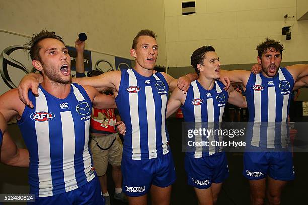 Kangaroos sing the team song after winning the round five AFL match between the Gold Coast Suns and the North Melbourne Kangaroos at Metricon Stadium...