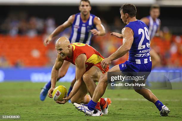 Gary Ablett of the Suns handballs during the round five AFL match between the Gold Coast Suns and the North Melbourne Kangaroos at Metricon Stadium...