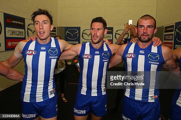 Kangaroos sing the team song after winning the round five AFL match between the Gold Coast Suns and the North Melbourne Kangaroos at Metricon Stadium...
