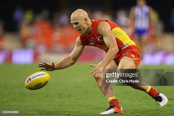 Gary Ablett of the Suns reaches for the ball during the round five AFL match between the Gold Coast Suns and the North Melbourne Kangaroos at...