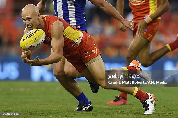 Gary Ablett of the Suns handballs during the round five AFL match between the Gold Coast Suns and the North Melbourne Kangaroos at Metricon Stadium...
