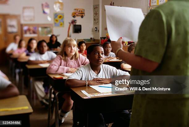 teacher going over exam instructions - multi ethnic group of students stock pictures, royalty-free photos & images