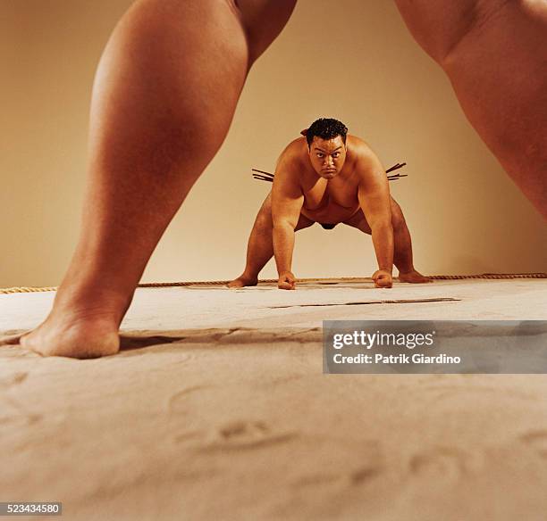 looking through the legs of a sumo wrestler - sumo stock pictures, royalty-free photos & images