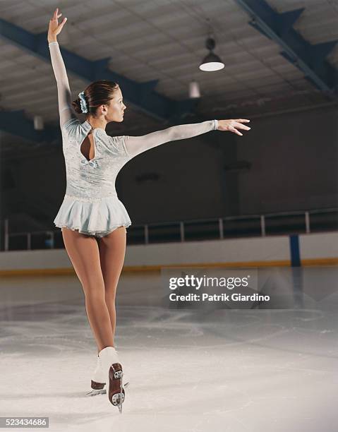 figure skater holding pose - figure skating stock pictures, royalty-free photos & images