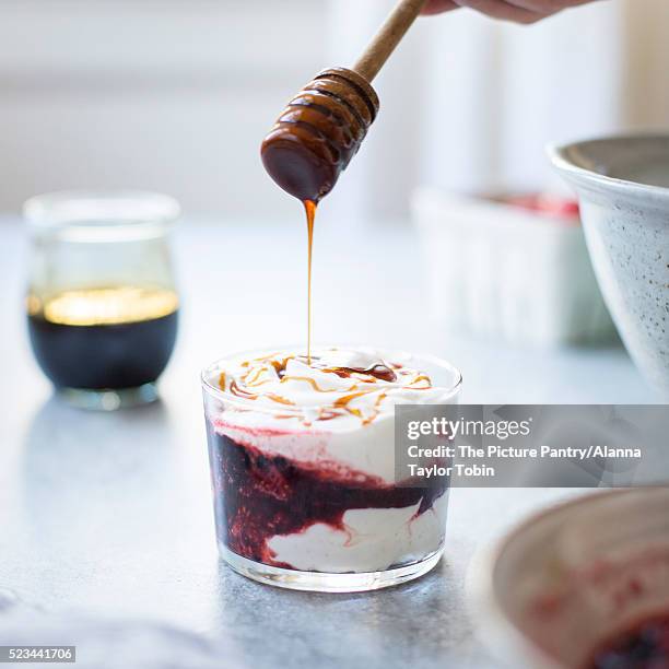 summer berries yoghurt fools dessert with buckwheat honey. - a fool stock pictures, royalty-free photos & images