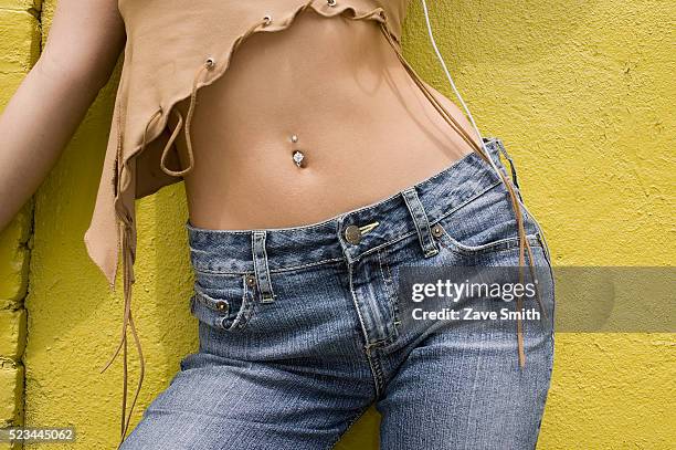 young woman with pierced midriff - navelpiercing bildbanksfoton och bilder