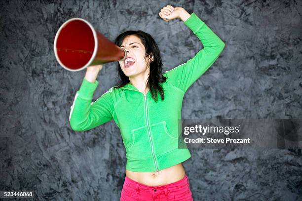 woman shouting into megaphone - encouragement stock pictures, royalty-free photos & images