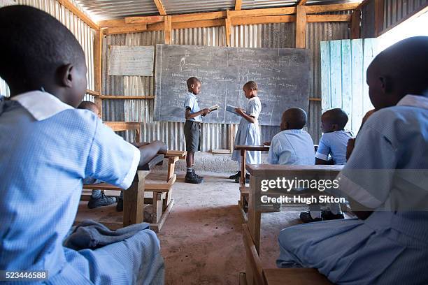 school children in classroom. kenya. - hugh sitton stockfoto's en -beelden