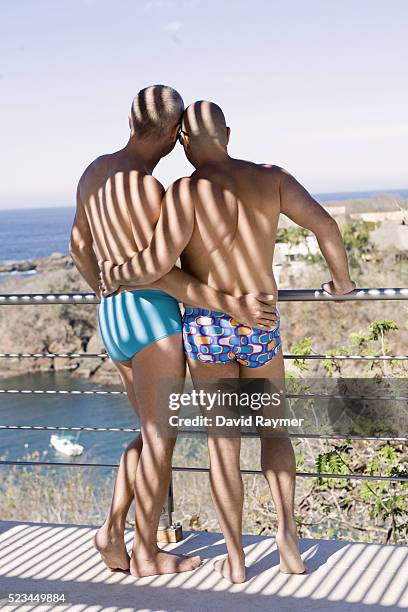 gay couple in swimsuits - gay men swimwear photos et images de collection