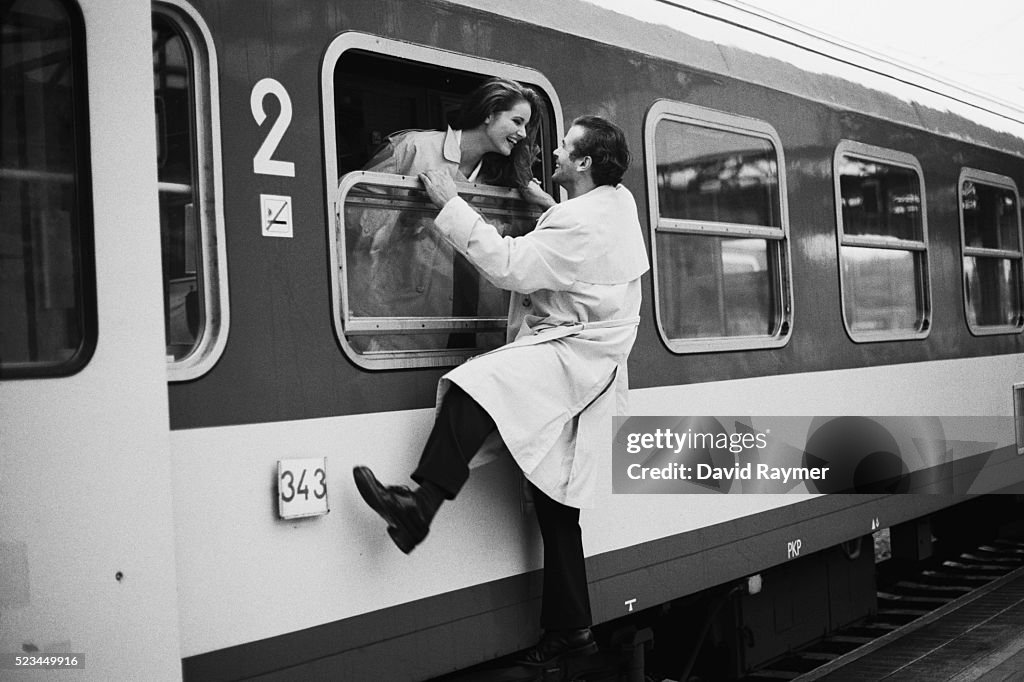 Man Saying Goodbye to Woman on Train