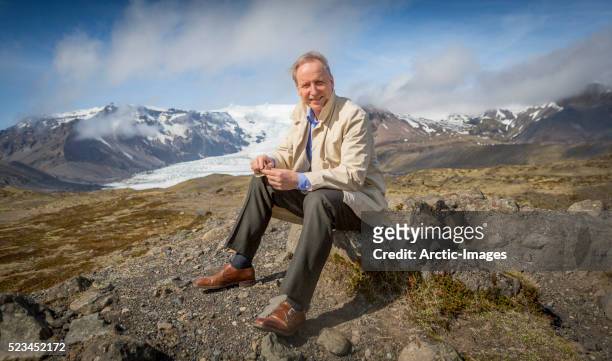 scientist enjoying the landscape, kviarjokull glacier in background, vatnajokull ice cap, iceland - climate research stock pictures, royalty-free photos & images