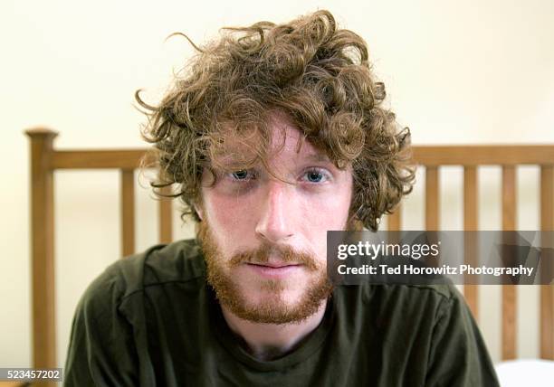 man with beard and disheveled hair - tired foto e immagini stock