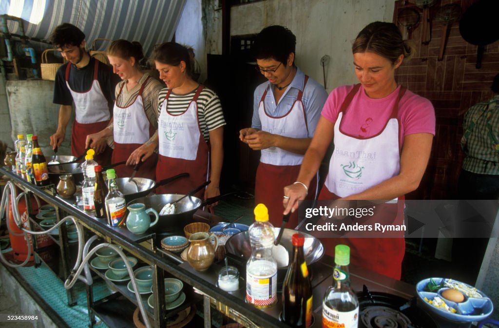 Tourists Taking Thai Cooking Class