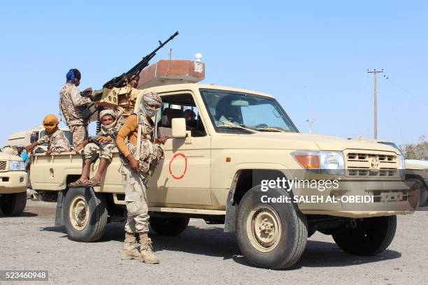 Forces loyal to the Saudi-backed Yemeni president stand guard on a road at the entrance to Abyan province as they take part in an operation to drive...