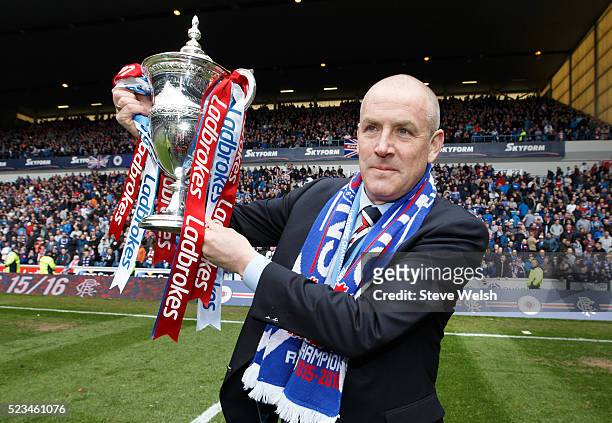 Mark Warburton the Rangers manager lifts the Scottish Championship Trophy at Ibrox Stadium on April 23, 2016 in Glasgow, United Kingdom.