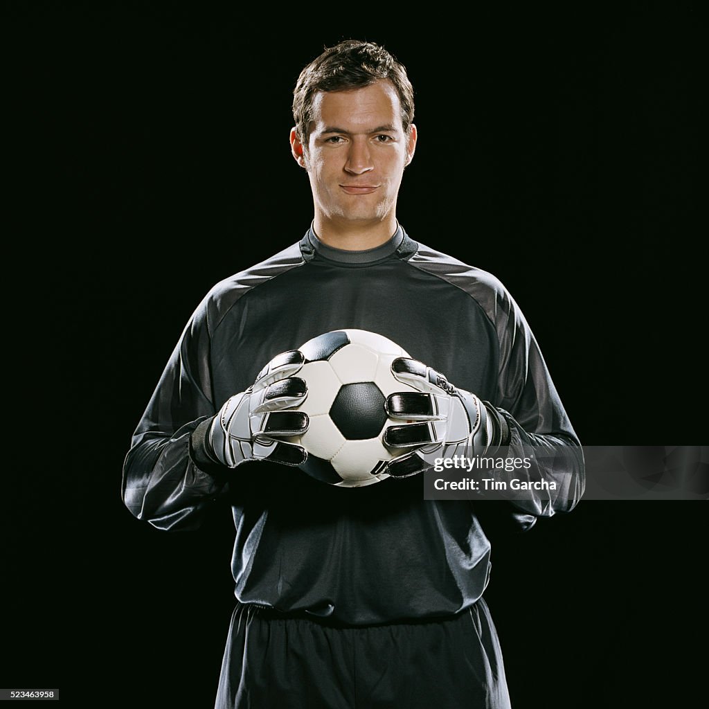 Goalkeeper Holding Soccer Ball