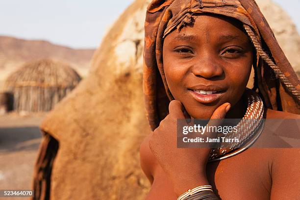 a young himba girl, close-up - kaokoveld stock pictures, royalty-free photos & images
