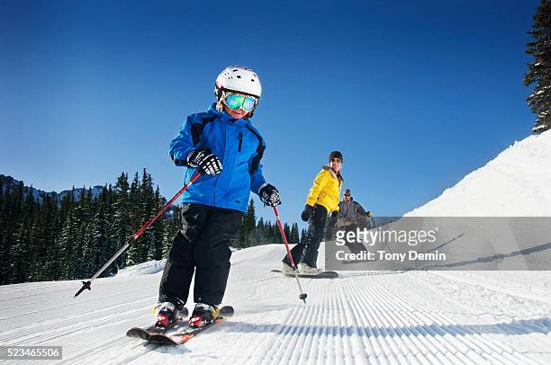 family skiing and snowboarding - skiing ストックフォトと画像