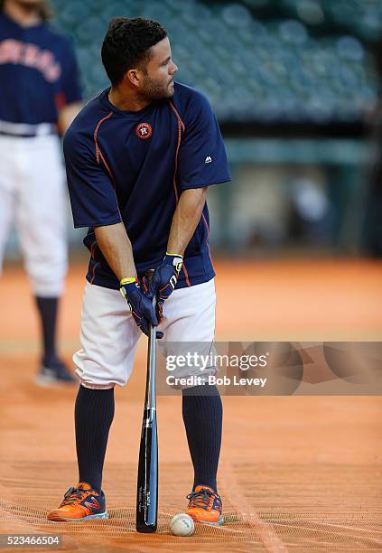Jose Altuve of the Houston Astros practices his golf swing during batting practice at Minute Maid Park on April 22, 2016 in Houston, Texas.