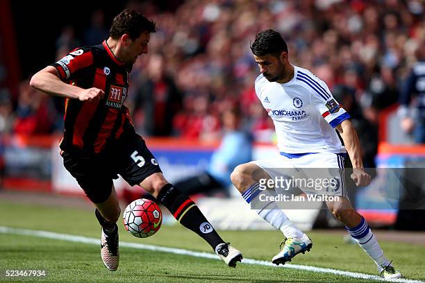 Diego Costa of Chelsea takes the ball past Tommy Elphick of Bournemouth during the Barclays Premier League match between A.F.C. Bournemouth and...