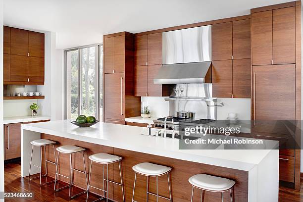 modern kitchen with stainless appliances - kitchen island ストックフォトと画像