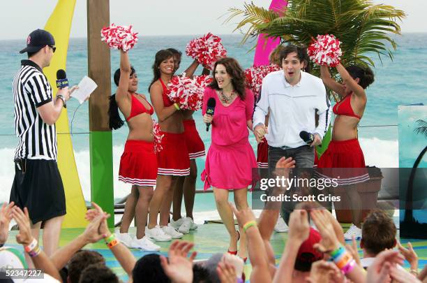 Actor Jimmy Fallon and actress Drew Barrymore appear onstage with VJ Damien Fahey during a taping for MTV Spring Break on the beach at The City...