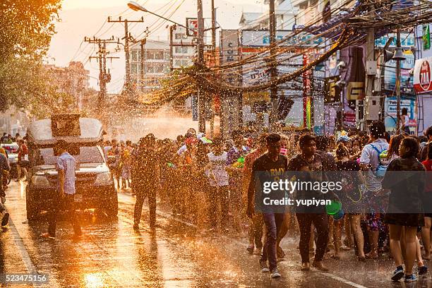 people celebrate in songkran festival day - songkran stock pictures, royalty-free photos & images