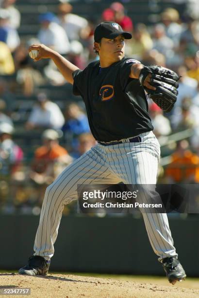 Starting pitcher Russ Ortiz of the Arizona Diamondbacks pitches against the Oakland Athletics during the MLB spring training game on March 7, 2005 at...