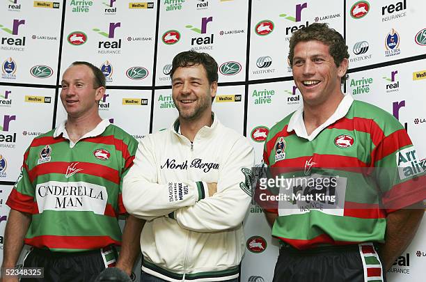 Russell Crowe poses with Rabbitohs players Adam MacDougall and Bryan Fletcher at a press conference to announce his upcoming movie "Cinderella Man"...