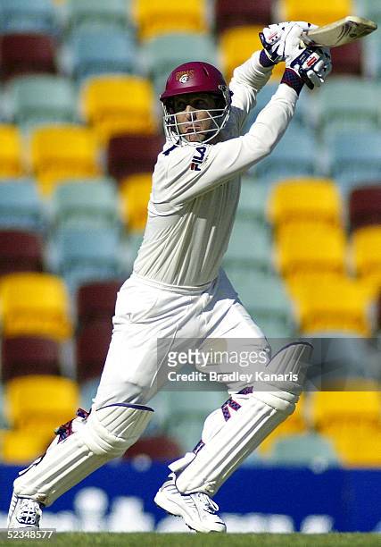 Wade Seccombe hits out during the Pura Cup match between the Queensland Bulls and Western Australia at Brisbane Cricket Ground on March 10, 2005 in...